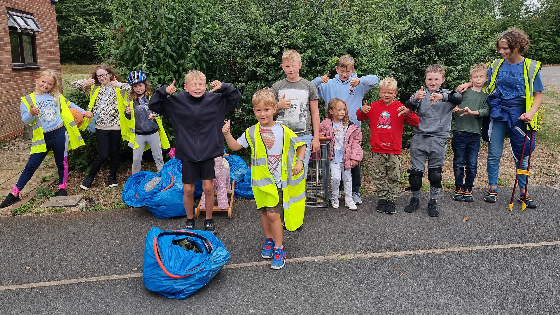 Community champion Emma Hills stood with children from the local community