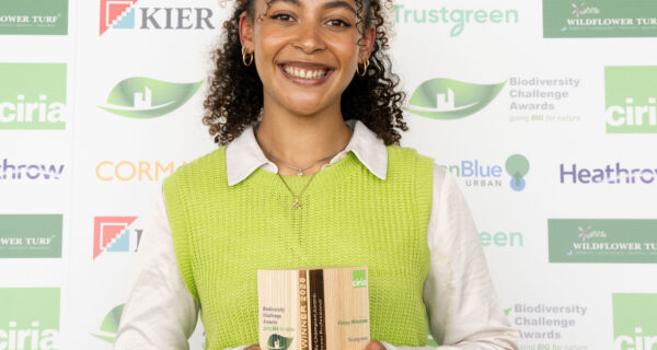Finley Wisdom holds her award with a smile